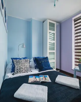 Łóżko lub łóżka w pokoju w obiekcie P&O Apartments Wola Tarasy