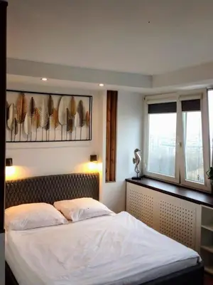 Łóżko lub łóżka w pokoju w obiekcie Alma Apartments Smolna