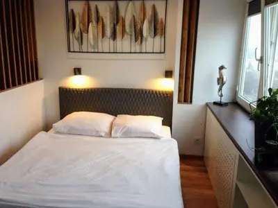 Łóżko lub łóżka w pokoju w obiekcie Alma Apartments Smolna