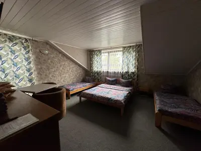 Łóżko lub łóżka w pokoju w obiekcie Guest House Villa Arkadia