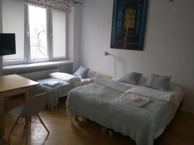 Łóżko lub łóżka w pokoju w obiekcie Studio Iwicka