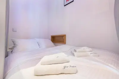 Łóżko lub łóżka w pokoju w obiekcie Piękna Apartament by Your Freedom