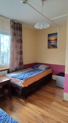 Łóżko lub łóżka w pokoju w obiekcie Henrix