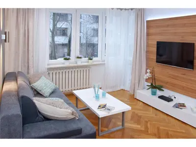 Telewizja i/lub zestaw kina domowego w obiekcie Srebrna Warsaw Apartment
