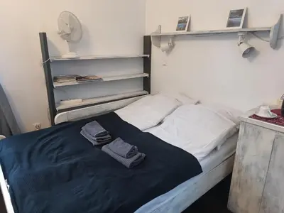 Łóżko lub łóżka w pokoju w obiekcie Studio Stare Miasto