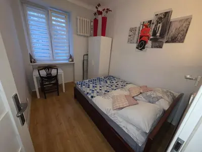Łóżko lub łóżka w pokoju w obiekcie Augusta Apartment