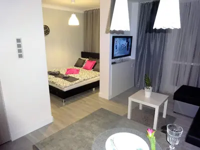 Łóżko lub łóżka w pokoju w obiekcie Apartament Junior