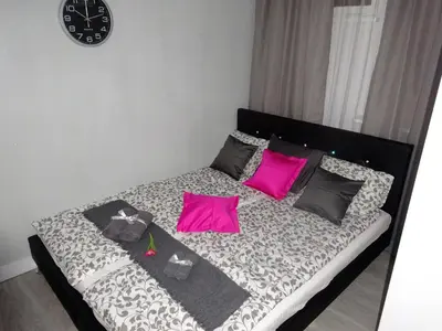 Łóżko lub łóżka w pokoju w obiekcie Apartament Junior