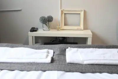 Łóżko lub łóżka w pokoju w obiekcie Noctis Apartment Nowogrodzka