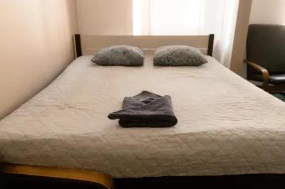 Łóżko lub łóżka w pokoju w obiekcie Hidden Peak - Guestrooms