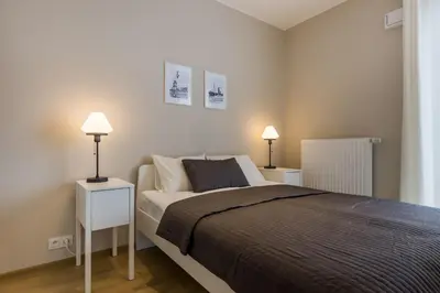 Łóżko lub łóżka w pokoju w obiekcie Okrzei 18 - studio by Homeprime