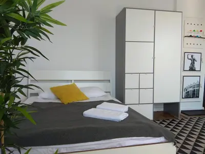 Łóżko lub łóżka w pokoju w obiekcie Apartament przy Rotundzie