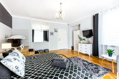 Łóżko lub łóżka w pokoju w obiekcie ClickTheFlat Apartment Chmielna 7