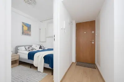 Łóżko lub łóżka w pokoju w obiekcie Apartments Dexter Warsaw by Noclegi Renters