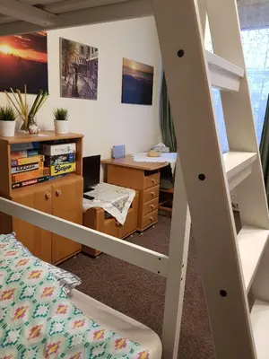 Łóżko lub łóżka w pokoju w obiekcie Emilka Apartment