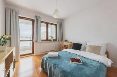 Łóżko lub łóżka w pokoju w obiekcie P&O Apartments Namyslowska
