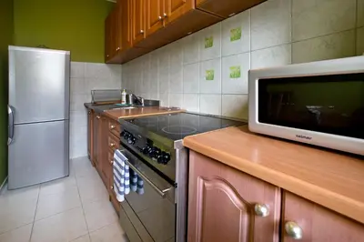 Kuchnia lub aneks kuchenny w obiekcie P&O Apartments Chomiczowka
