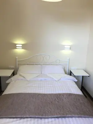 Łóżko lub łóżka w pokoju w obiekcie Apartamenty przy Arkadii