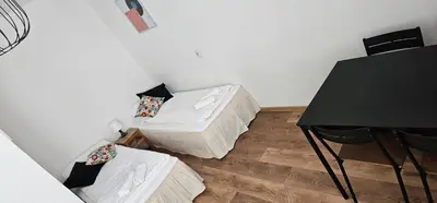 Łóżko lub łóżka w pokoju w obiekcie Wołoska 80