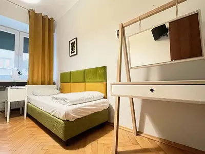 Łóżko lub łóżka w pokoju w obiekcie Hostel Helvetia - Private Rooms in City Center