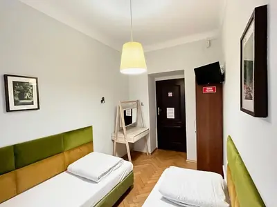 Łóżko lub łóżka w pokoju w obiekcie Hostel Helvetia - Private Rooms in City Center