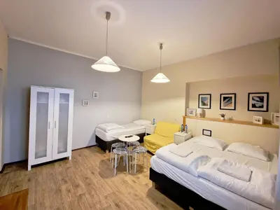Łóżko lub łóżka w pokoju w obiekcie Hostel Helvetia - Private Rooms in City Center