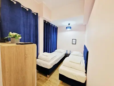 Łóżko lub łóżka w pokoju w obiekcie Hostel Helvetia - Private Rooms in City Center