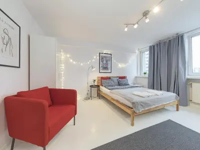 Łóżko lub łóżka w pokoju w obiekcie Sliska apartment Warsaw