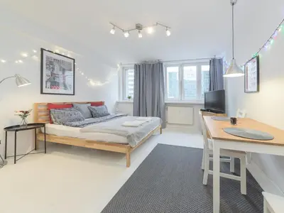 Łóżko lub łóżka w pokoju w obiekcie Sliska apartment Warsaw