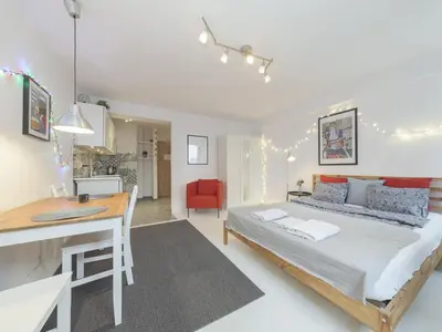 Łóżko lub łóżka w pokoju w obiekcie Sliska apartment Warsaw