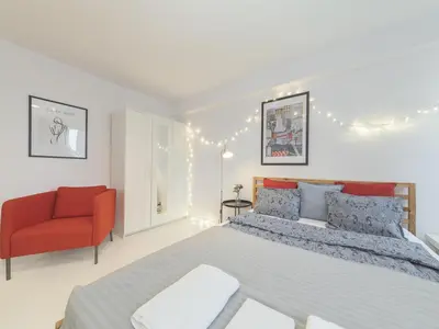 Łóżko lub łóżka w pokoju w obiekcie Sliska apartment Warsaw