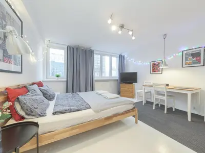 Łóżko lub łóżka w pokoju w obiekcie Sliska apartment Warsaw