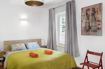 Łóżko lub łóżka w pokoju w obiekcie Evva & Peppe Old Town Flat