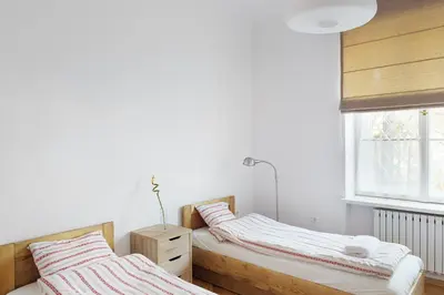 Łóżko lub łóżka w pokoju w obiekcie Bednarska Old Town Apartment