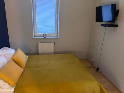 Łóżko lub łóżka w pokoju w obiekcie Apartament w Wesołej