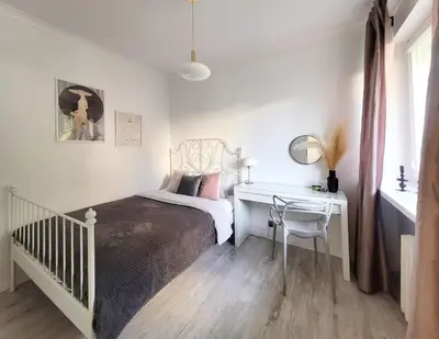 Łóżko lub łóżka w pokoju w obiekcie Warsaw Concierge Opera Apartment