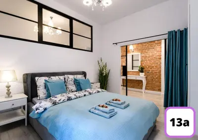 Łóżko lub łóżka w pokoju w obiekcie Sienna 41 Boutique Warsaw Apartments