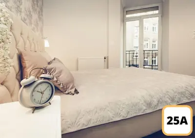 Łóżko lub łóżka w pokoju w obiekcie Sienna 41 Boutique Warsaw Apartments