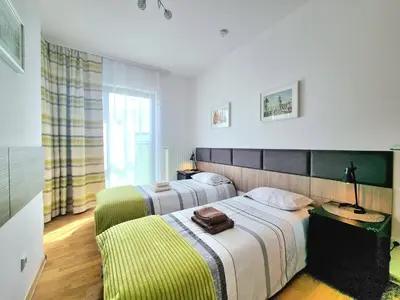 Łóżko lub łóżka w pokoju w obiekcie Wilanow Apartment