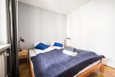 Łóżko lub łóżka w pokoju w obiekcie oompH Warsaw Central 3-bedroom Flat