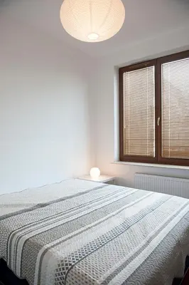 Łóżko lub łóżka w pokoju w obiekcie DOMOTEL MOKOTÓW