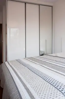 Łóżko lub łóżka w pokoju w obiekcie DOMOTEL MOKOTÓW