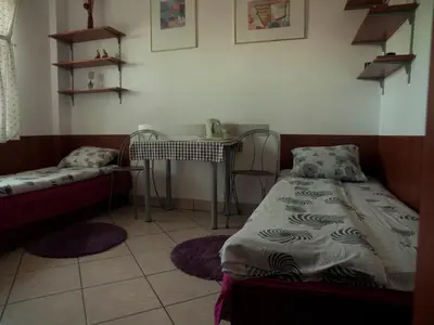 Łóżko lub łóżka w pokoju w obiekcie Pokoje Gościnne 