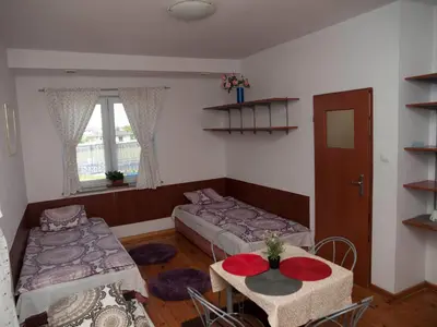 Łóżko lub łóżka w pokoju w obiekcie Pokoje Gościnne 