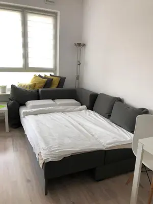 Łóżko lub łóżka w pokoju w obiekcie Apartamenty Metro Słodowiec, free parking Żeromskiego 1 CMKP- 5 min