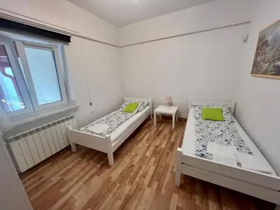 Łóżko lub łóżka w pokoju w obiekcie Sosnowy apartament