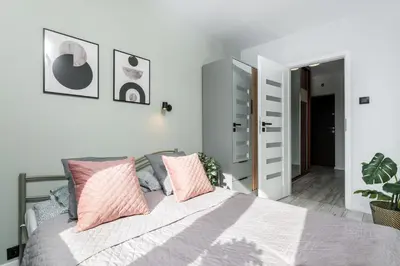 Łóżko lub łóżka w pokoju w obiekcie Avocado Apartment 2 rooms in the City Center