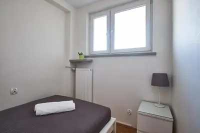 Łóżko lub łóżka w pokoju w obiekcie Noctis City Center IV
