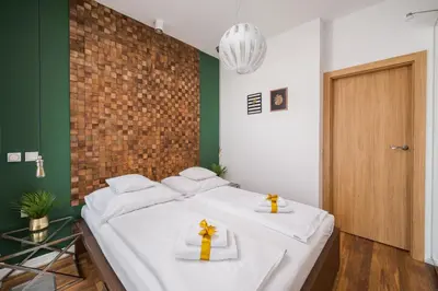 Łóżko lub łóżka w pokoju w obiekcie ApartHotel Kolejowa Apartamenty