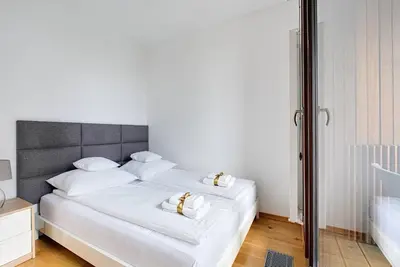 Łóżko lub łóżka w pokoju w obiekcie ApartHotel Kolejowa Apartamenty